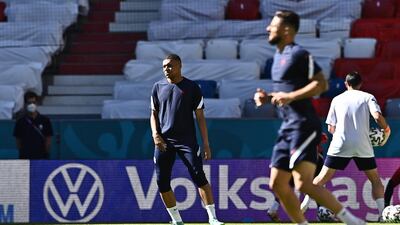 France players Kylian Mbappe and Olivier Giroud warm up during the training session in Munich ahead of the Euro 2020 Group F match against Germany. EPA
