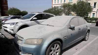 A dirty, abandoned car parked in Discovery Gardens, Dubai. Pawan Singh / The National