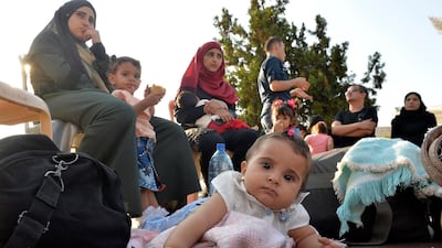 Syrian refugees gather as they prepare to leave Beirut, Lebanon, for Syria in September. Many newborns are unregistered and, without documentation, do not have access to healthcare. Wael Hamzah/EPA