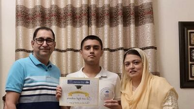 Muneeb Alvi, a pupil at Pristine Private School Dubai who received three A*, with his parents Hina Nihal and Nihal Alvi Courtesy: Muneeb Alvi