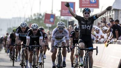 Elia Viviani of Team Sky begins to celebrate as he crosses the finish line to win Stage 2 of the Abu Dhabi Tour on Friday. Angelo Carconi / EPA