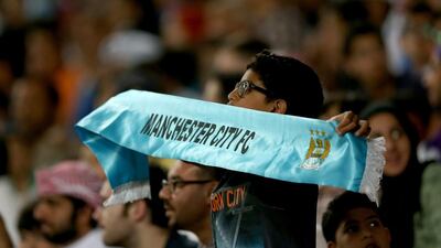 A young fans cheers his team on during the friendly. Warren Little / Getty Images