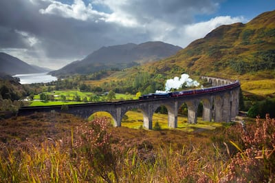 UK, Scotland, Highland, Loch Shiel, Glenfinnan, Glenfinnan Railway Viaduct, part of the West Highland Line, The Jacobite Steam Train, made famous in JK Rowling's Harry Potter as the Hogwarts Express. Getty Images