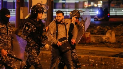 Riot police restrain a protester in Beirut. Reuters