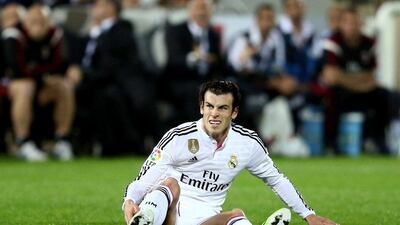 Gareth Bale of Real Madrid looks on after slipping during his side's 4-2 friendly loss to AC Milan in Dubai on Tuesday at The Sevens. Warren Little / Getty Images / December 30, 2014