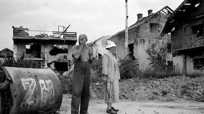 A couple survey the devastation of their neighbourhood near Sarajevo airport, where intense shelling and fighting had reduced nearly every house to rubble, in April 1996, in Sarajevo. Tom Stoddart Archive