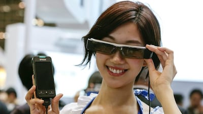 A model displays Seiko Epson’s next-generation wearable device smart glass Moverio. Kimimasa Mayama / EPA