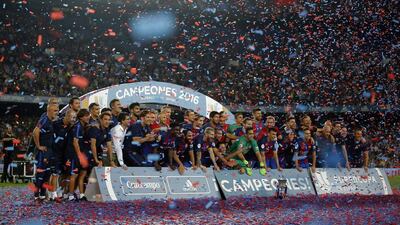 Barcelona players celebrate their victory after winning the Spanish Super Cup between FC Barcelona and Sevilla at the Camp Nou in Barcelona, Spain, Thursday, August 18, 2016. Manu Fernandez / AP Photo
