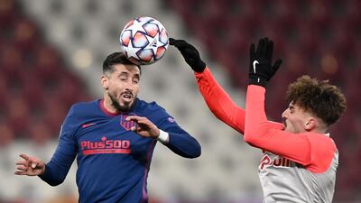 Atletico Madrid's Hector Herrera wins a header. EPA