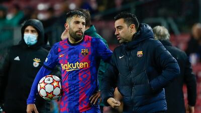 Barcelona's head coach Xavi talks to Jordi Alba. AP