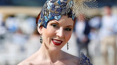 Ladies dress glamorously for the occasion, one of the richest horse races on the calendar. EPA