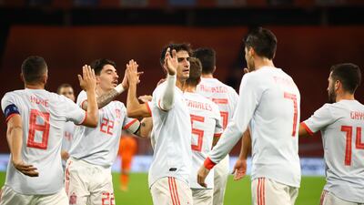 Spain’s Sergio Canales celebrates with Hector Bellerín, Gerard Moreno and teammates after scoring the opening goal. Reuters