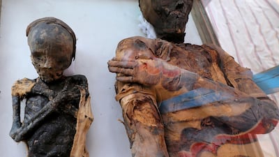 Two mummies, of a woman and child, are on display at the newly discovered burial site, the Tomb of Tutu, at al-Dayabat, Sohag, Egypt. REUTERS