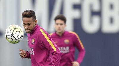 Barcelona’s Brazilian forward Neymar controls a ball during a training session at the Sports Center FC Barcelona Joan Gamper in Sant Joan Despi, near Barcelona on April 1, 2016 on the eve their Spanish La Liga Clasico football match FC Barcelona vs Real Madrid. AFP / LLUIS GENE
