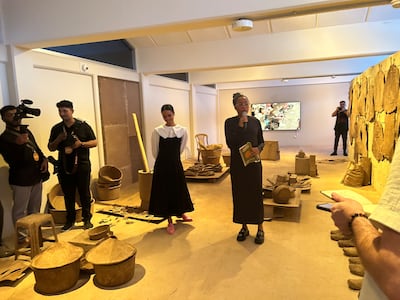 Sandra Poulson, middle, and curator Tosin Oshinowo, right, in Poulson's exhibition Dust As An Accidental Gift. Razmig Bedirian / The National