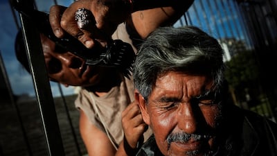 People join in a solidarity 'No Families Without Christmas' dinner outside the National Congress in Buenos Aires, Argentina, organised to support those affected by poverty. Reuters