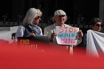 Pro-Palestinian activists take part in a protest outside the Royal Courts of Justice, in central London. AFP