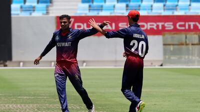 Kuwait's Jandu Hamouda celebrates dismissing Niel Lobo.