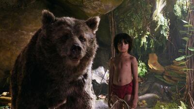 Neel Sethi as Mowgli with Baloo, voiced by Bill Murray. Courtesy Disney