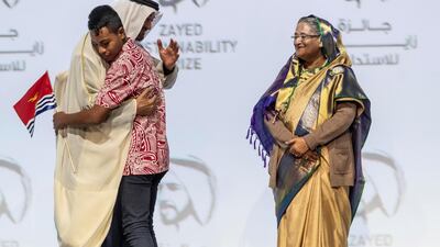Sheikh Mohamed bin Zayed, Crown Prince of Abu Dhabi and Deputy Supreme Commander of the Armed Forces, embraces Buretaake Ioane, 15, at the awards in 2020. His school, Eutan Tarawa Ieta Junior Secondary School in the Republic of Kiribati, won first place in its region in the "global high schools" category. Antonie Robertson / The National