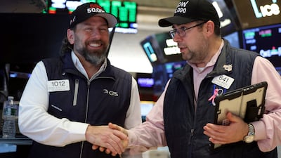 Traders celebrate as the Dow Jones Industrial Average passes the 50,000 mark on the floor at the New York Stock Exchange. Reuters
