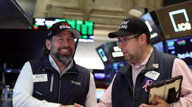 Traders react as the Dow Jones Industrial Average surpasses the 50,000 mark on the floor at the New York Stock Exchange (NYSE) in New York City. Reuters