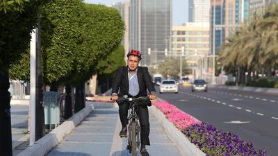 Rami Eljundi going cycles home after his day’s work in Abu Dhabi. Pawan Singh / The National