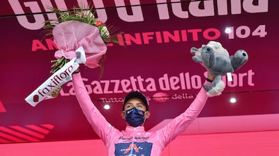 Ineos Grenadiers rider and race leader Egan Bernal Gomez on the podium after Stage 20. Reuters