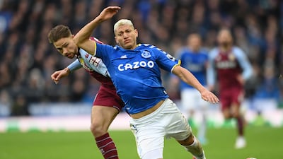 Richarlison of Everton is challenged by Matty Cash of Aston Villa. Getty