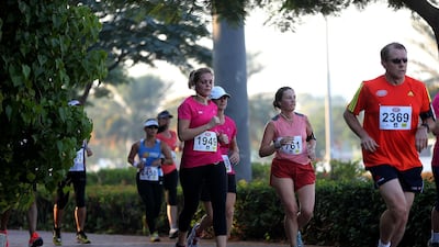 Residents in UAE participate in a half marathon in Dubai. Satish Kumar / The National