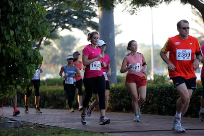 Residents in UAE participate in a half marathon in Dubai. Satish Kumar / The National