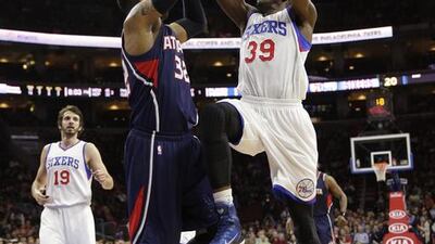 Philadelphia’s Jerami Grant, right, drives the lane during the 76ers’ win over the first-place Atlanta Hawks this past week. Matt Slocum / AP Photo