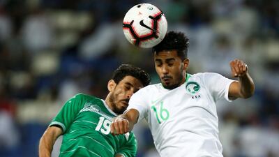 Iraq's Mahdi Kamel in action with Saudi Arabia's Hussain Al-Mogahwi. Reuters