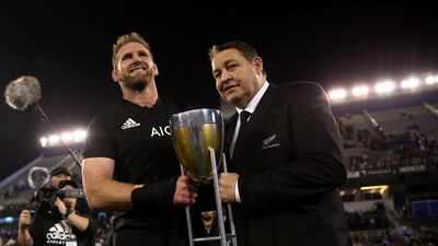 New Zealand's captain Kieran Reid and coach Steve Hansen pose with the Rugby Championship trophy. Marcos Brindicci / Reuters