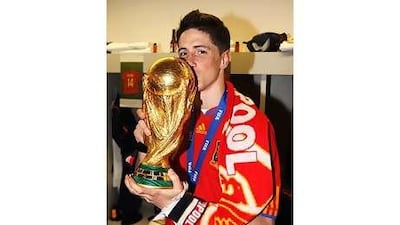 Fernando Torres, draped in the scarf of Liverpool, his club side, after he won the World Cup, is currently sidelined with an injury he picked up in the final, ruling him out of the friendly against Mexico.