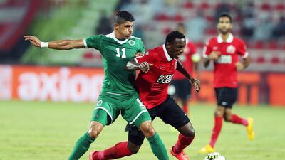 Al Shabab’s Henrique Luvannor, in green, tackles Ahmed Khalil, Al Ahli’s first goalscorer at the Rashid Stadium. Ashraf Al Amra / Al Ittihad