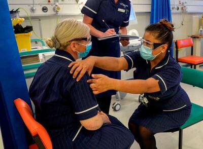 A training session in the Covid-19 Vaccination Clinic at the University Hospital in Coventry, central England last week. A network of more than 50,000 people with basic medical skills will be needed to administer the doses. AFP