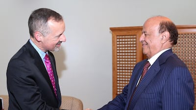 British ambassador to Yemen Edmund Fitton-Brown shakes hand with Yemen's President Abd-Rabbu Mansour Hadi (R) in 2015.