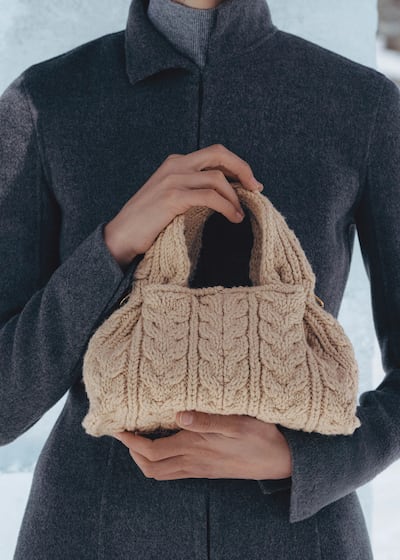 Oversized jewellery, tactile bags and over-the-knee boots bring texture and drama to otherwise polished winter looks. Photo: Polene