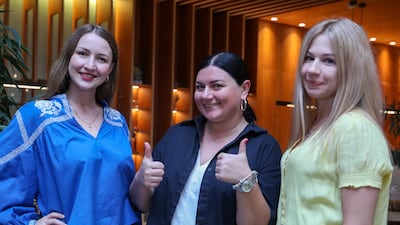 From left, Alina, Anastasiia and Ksenia are Ukrainian citizens living in the UAE. All photos: Victor Besa / The National