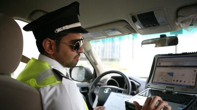An officer from Saaed, the road service patrol service that deals with minor road accidents and helps motorists who have technical problems with their cars. Fatima Al Marzouqi/ The National