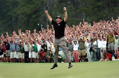 Phil Mickelson celebrates after winning the Masters golf tournament in 2004. AP