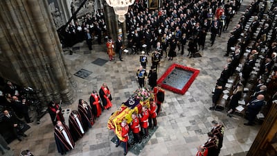 King Charles III and Camilla, Queen Consort walking alongside the coffin carrying the remains of Queen Elizabeth II, as it departs Westminster Abbey, during the State Funeral of Queen Elizabeth. Taken by Gareth Cattermole. Getty Images/PA