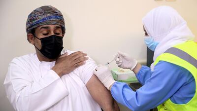 A man receives his first dose of the Pfizer-BioNTech Covid-19 vaccine in the Omani capital, Muscat. AFP