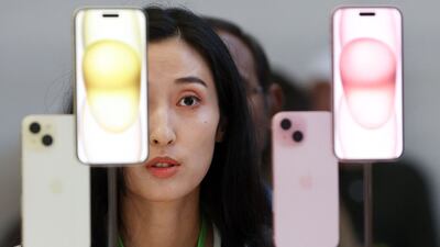 A guest looks at the brand new Apple iPhone 15 during the Apple 'Wonderlust' event on September 12 in Cupertino, California. Getty Images / AFP