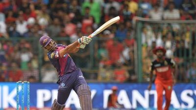 Rising Pune Supergiants captain and batsman MS Dhoni plays a shot during the 2016 Indian Premier League (IPL) Twenty20 cricket match between Royal Challengers Bangalore and Rising Pune SuperGiants, at The M Chinnaswamy Stadium in Bangalore on May 7, 2016. Manjunath Kiran / AFP