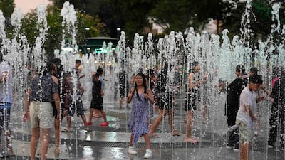 Keeping cool at the water fountain park Magic Water Circuit, in Lima, Peru. AP