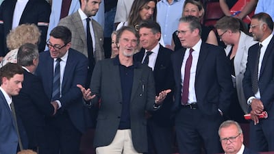 Sir Jim Ratcliffe with Andy Burnham, left, and Keir Starmer, right, at Old Trafford in 2024. Getty