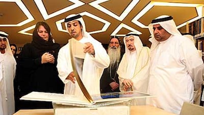 Sheikh Mansour bin Zayed takes a tour of the newly opened library yesterday. The new facility has 5,000 books, journals and manuscripts among its current collection.