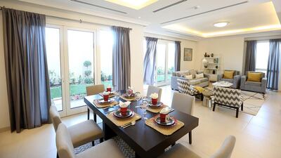 The living room and dining area in a three-bedroom villa at Villa Lantana. Satish Kumar / The National